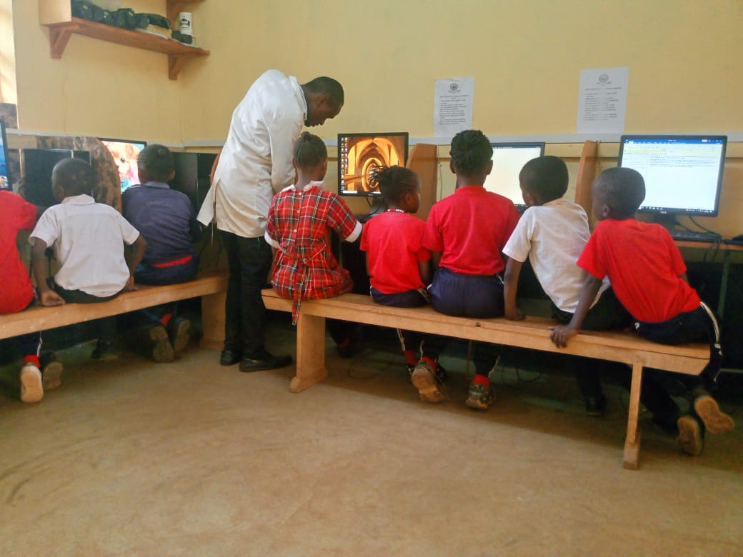 Pupils at the Computer Resource Centre with an instructor